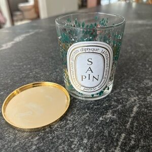 Diptyque Sapin Candle with Green and Gold Accents